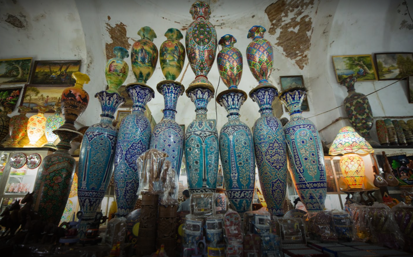 Kashigari vases beneath the vaulted brick ceiling